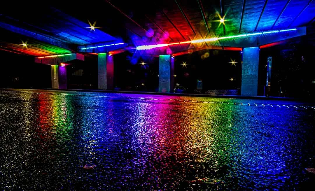 Vibrant colours reflected in the rain soaked road