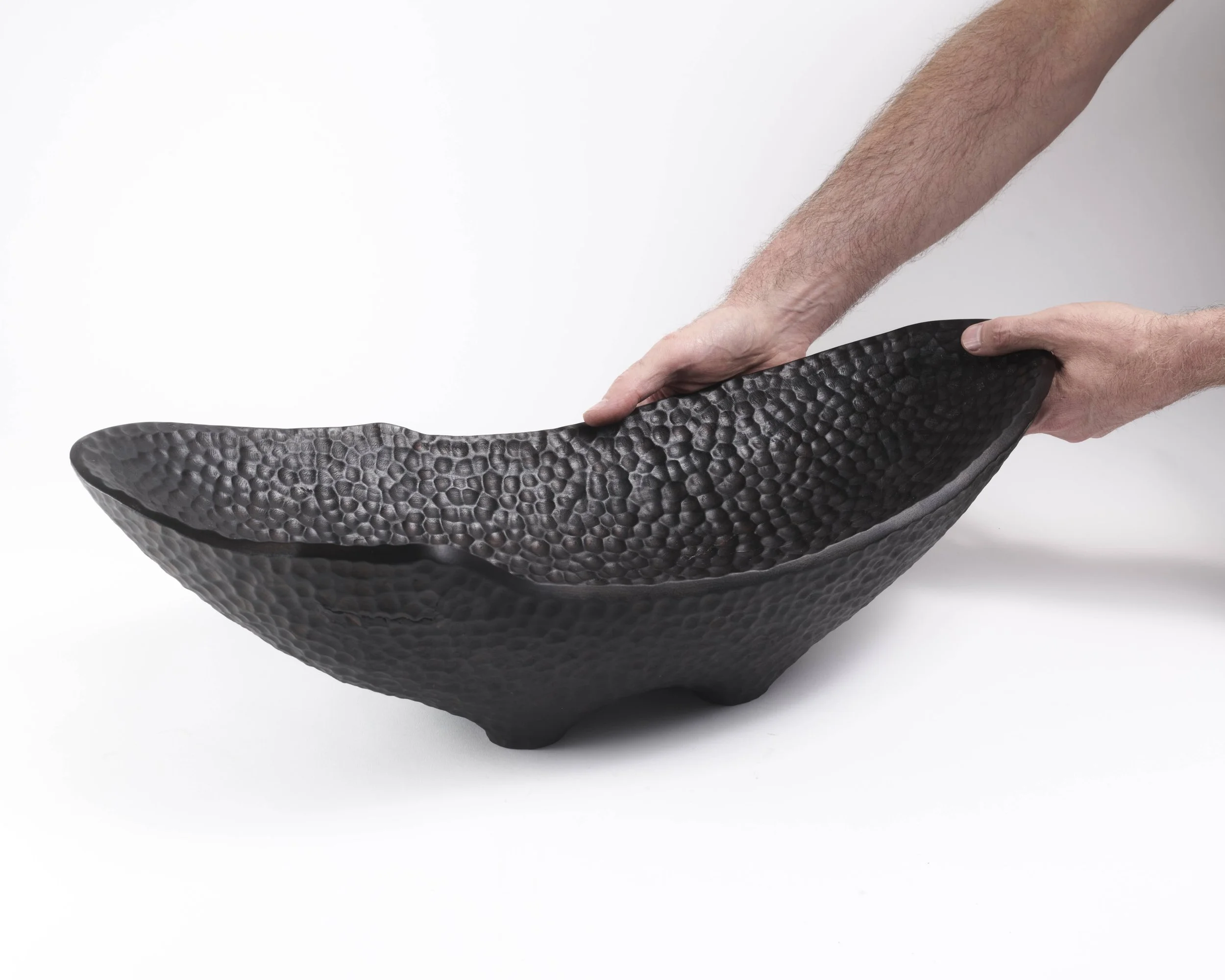 This contemporary sculpture is held by the artist. A collectible design for art collectors, interior designers, now chosen for a gallery exhibition by Hypha Curates, London.