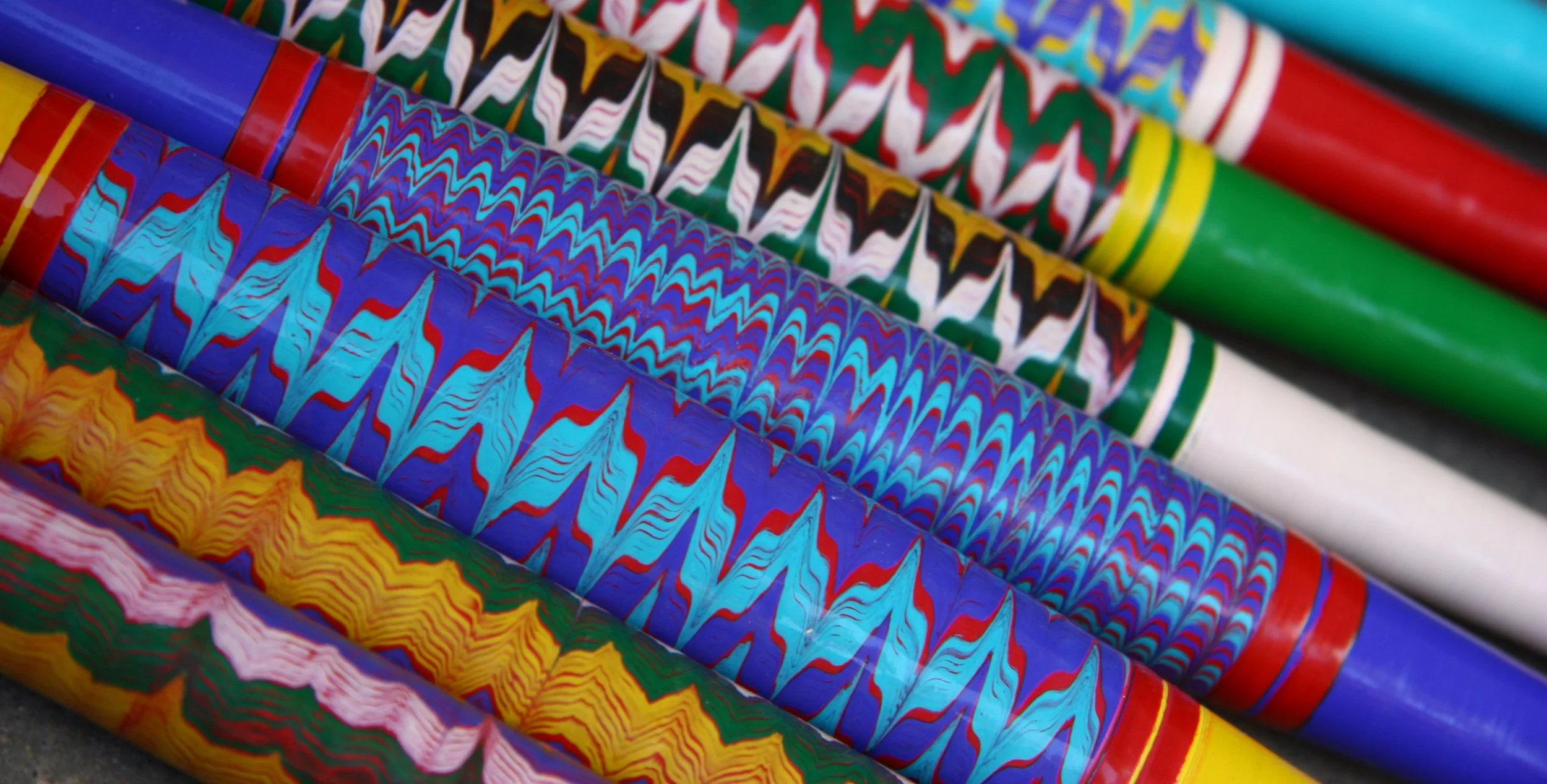 Close-up of colourful, patterned lacquer finished turned wooden legs, made by craft workers in India