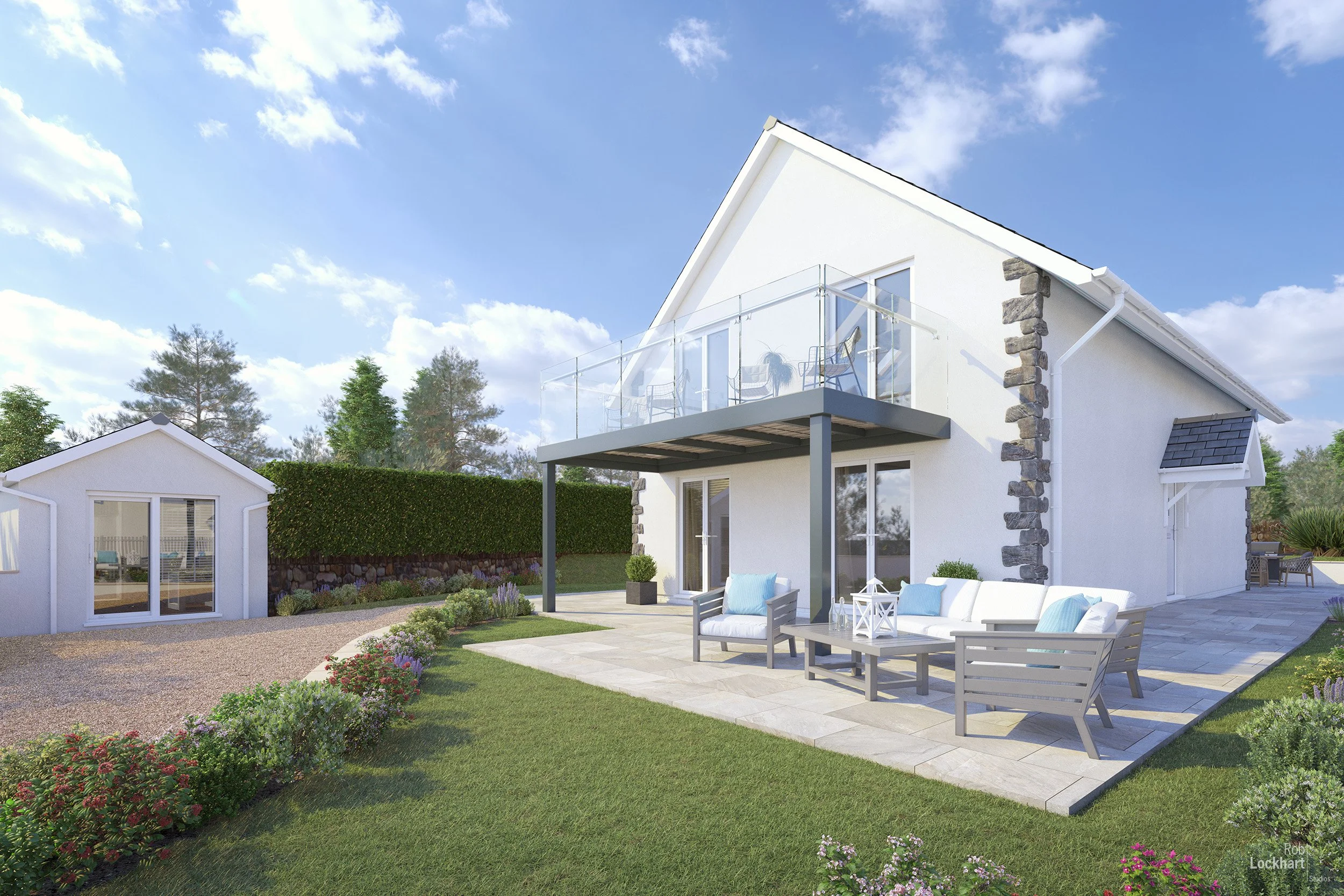 A modern white house with a balcony and outdoor seating area on a sunny day with blue sky. There is a small garden with colorful flowers and green grass, and a detached white outbuilding in the yard.
