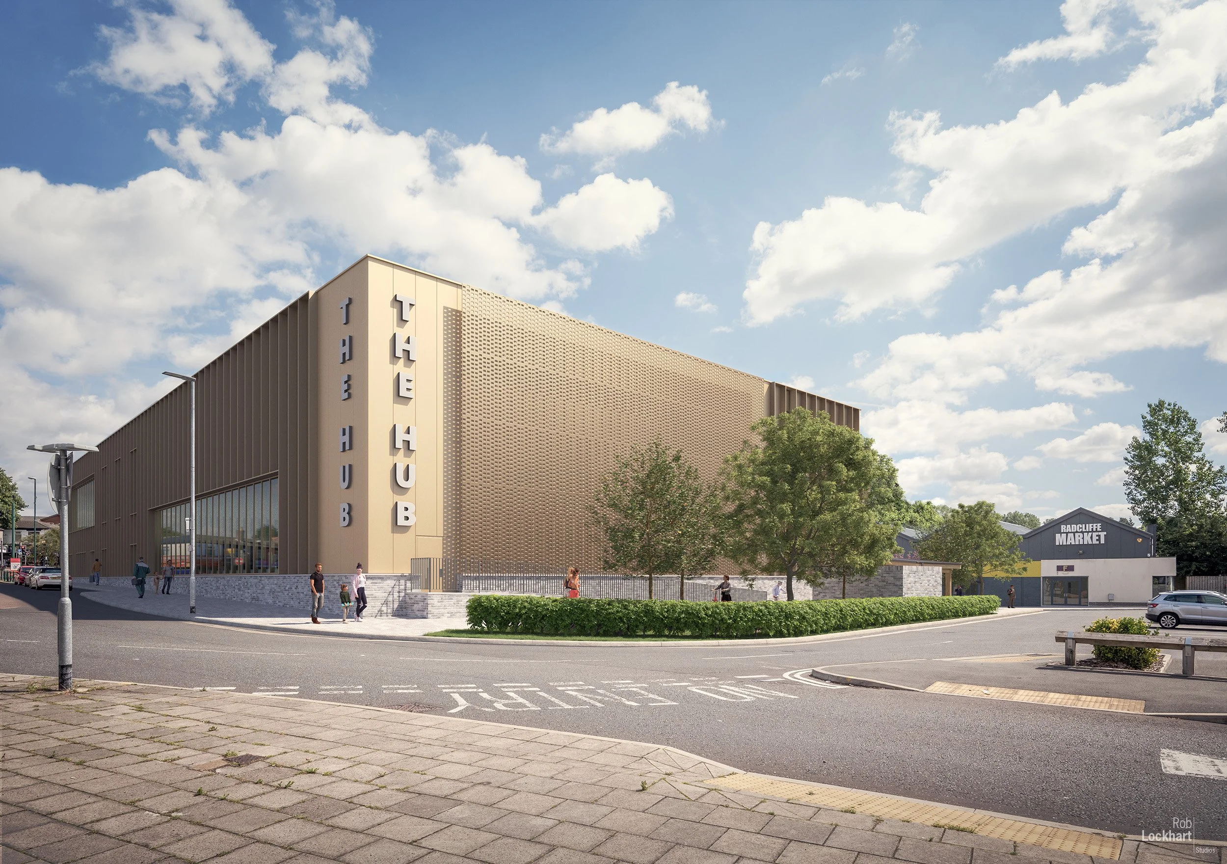 A modern building with vertical sign reading 'THE HUB' on a corner, located on a street with people walking, trees, a hedge, and a parking lot with cars, under a partly cloudy sky.
