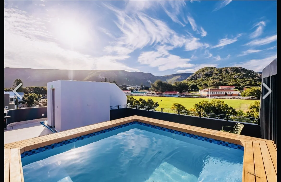 Rooftop pool and BBQ area at Oakwood apartment building - shared space for all  units - Whale Walk Apartment