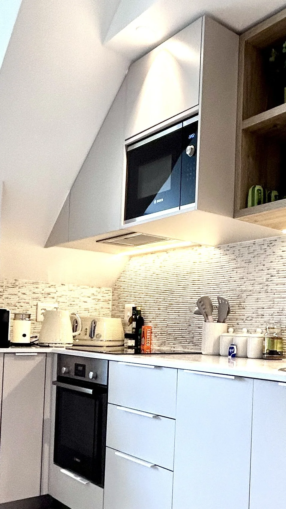 Modern, fully equipped kitchen with coffee station. Premium built in appliances throughout.