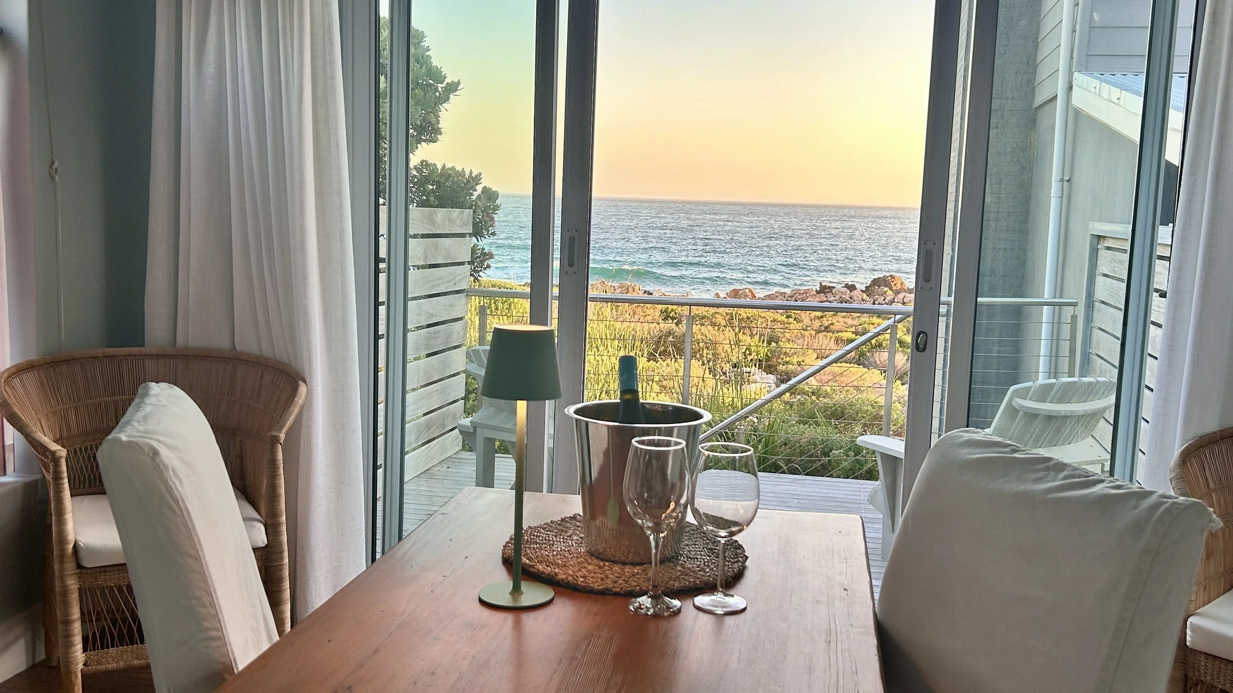 Sea View dining room and kitchen with private Ocean view deck at Misty Shores Cottage.