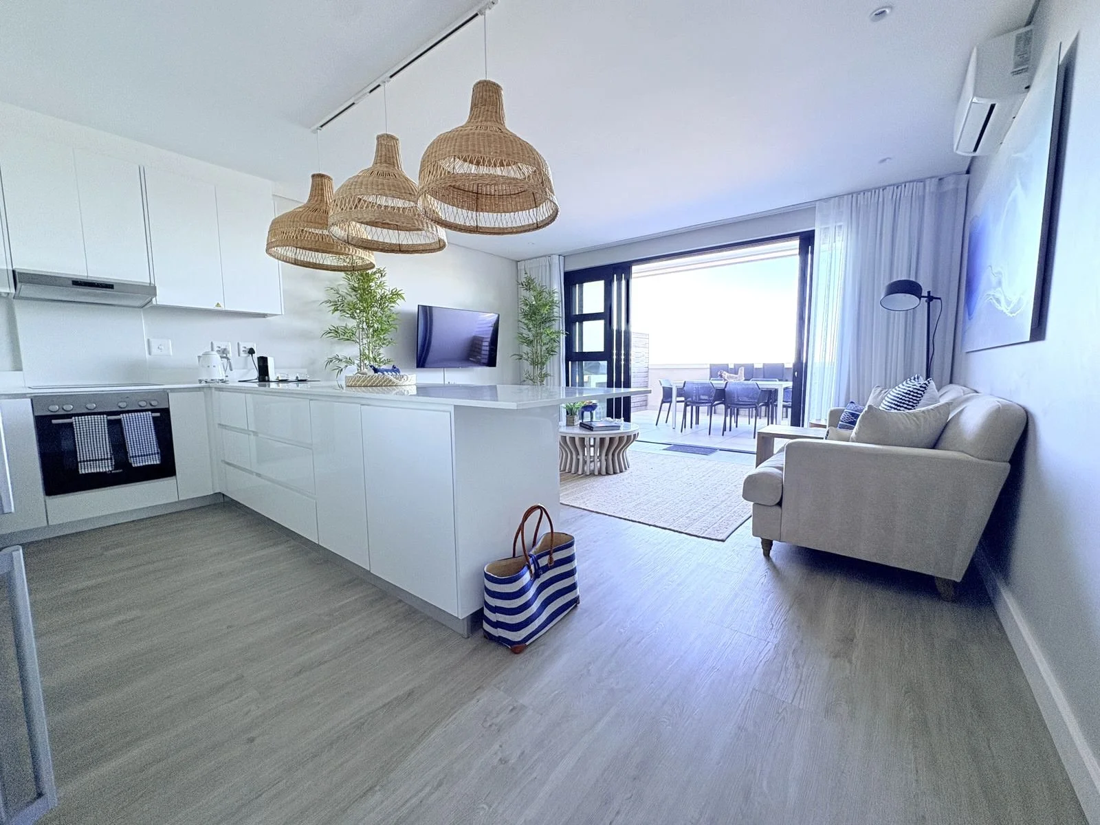 View from kitchen through to lounge and large private patio at The View