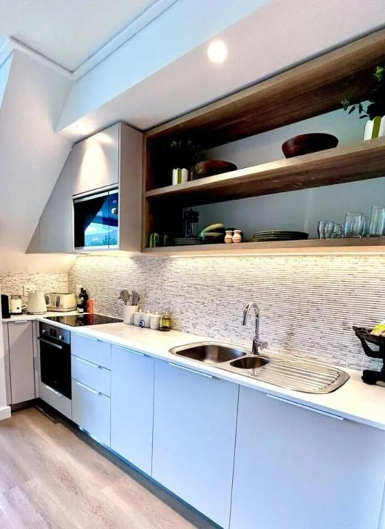 Modern, fully equipped kitchen with coffee station. Premium built in appliances throughout.