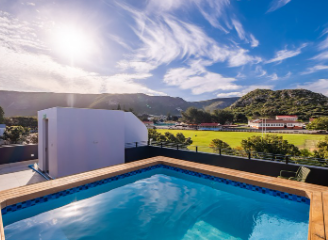 Swimming pool with mountain and sky view