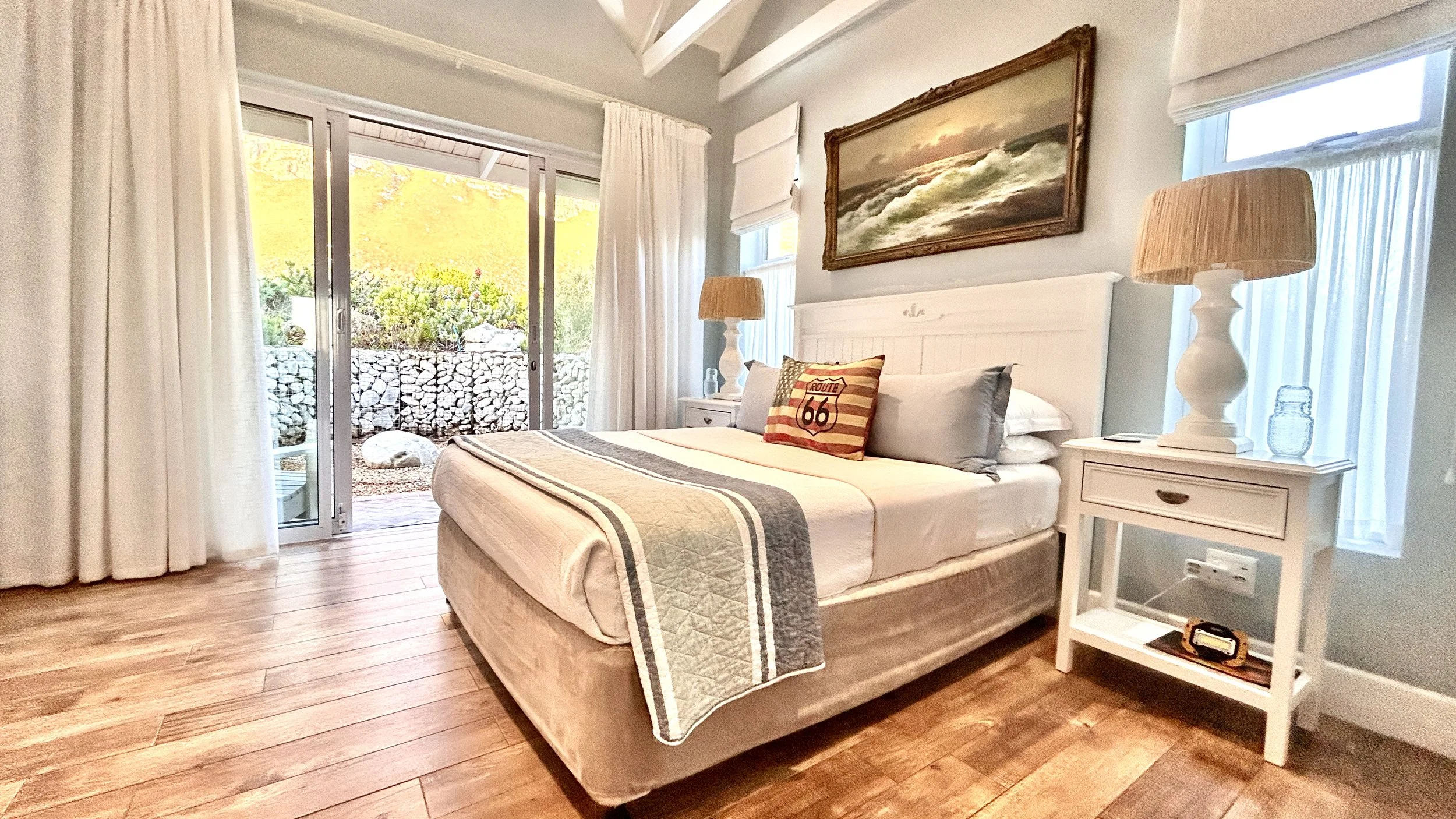 Main bedroom with queen bed, private patio and view of the Kogelberg at Misty shores.