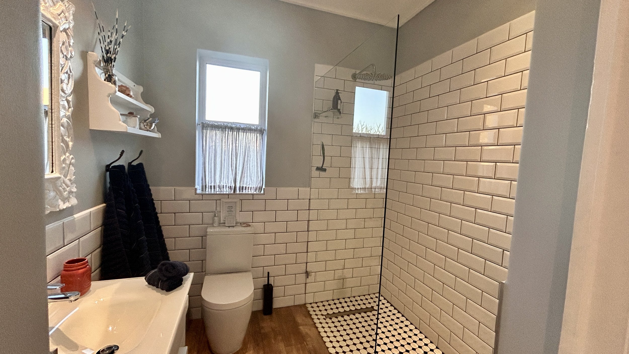 MES bathroom with walk in shower at Misty Shores