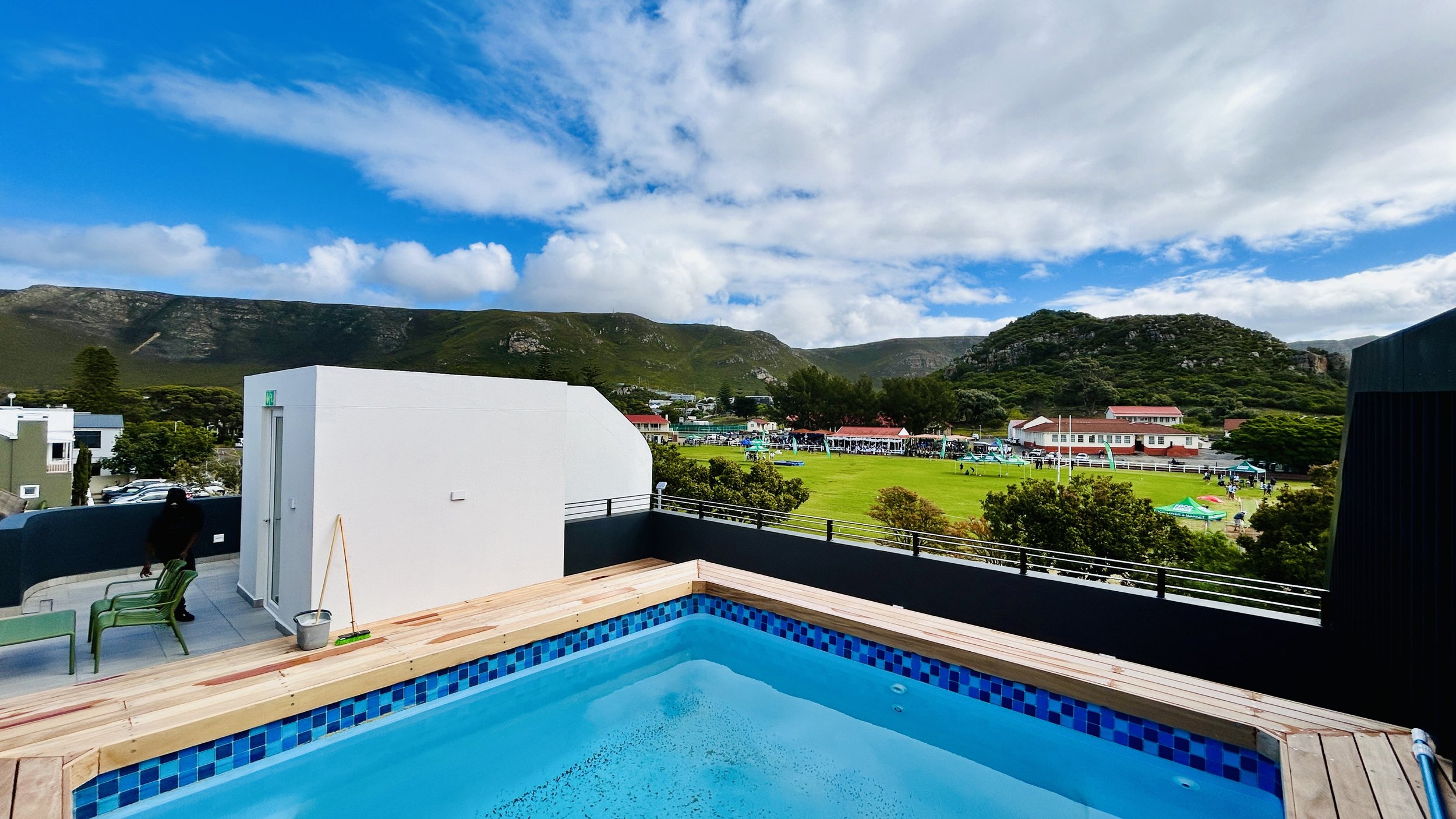 Rooftop pool and BBQ area at Oakwood apartment building - shared space for all  units - Whale Walk Apartment