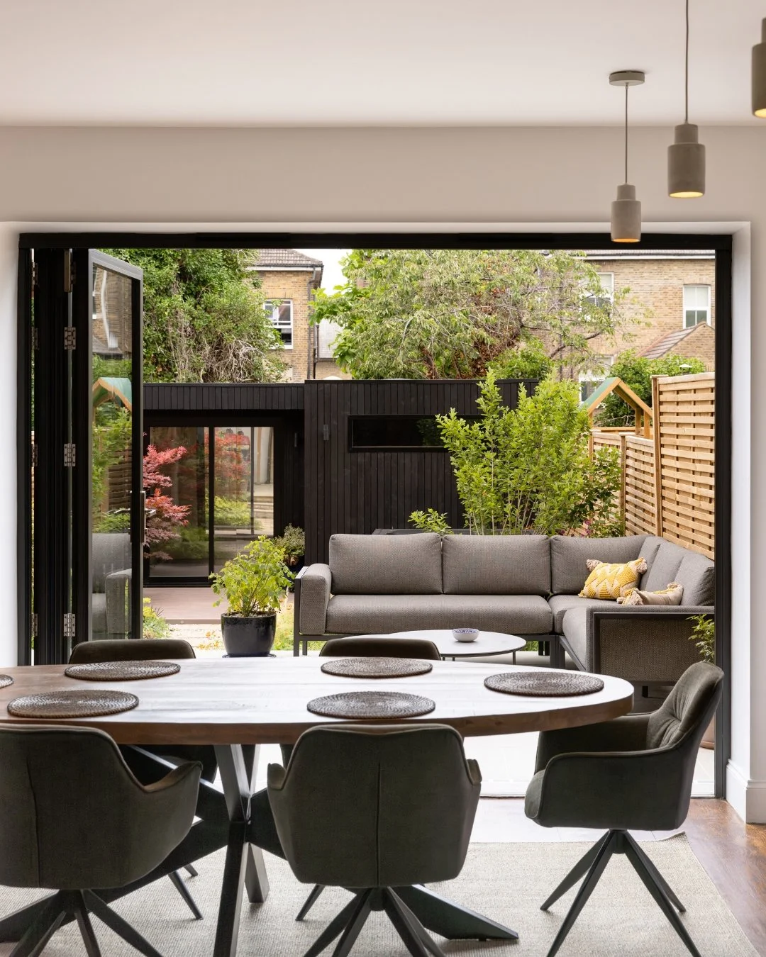 "It's changed our relationship with our home." That's what Andrew and Amy told us after we finished their Brockley garden, and it's exactly what we design for.

Dining patio, outdoor kitchen, garden room, sauna, all built around how this fa