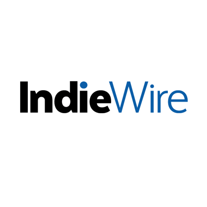 IndieWire logo with black and blue text on a white background.