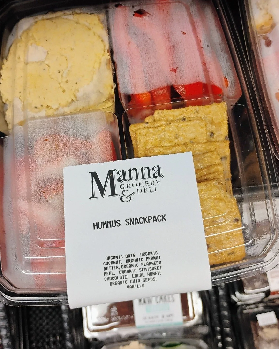 Reminder that the Manna Deli is closed this week through Wednesday, reopening Thursday 3/19. 

Our Grab N Go Cooler is stocked full for all your lunch needs! We've got salmon croquettes, hummus, energy bites, sandwiches, snack packs, drinks and treat