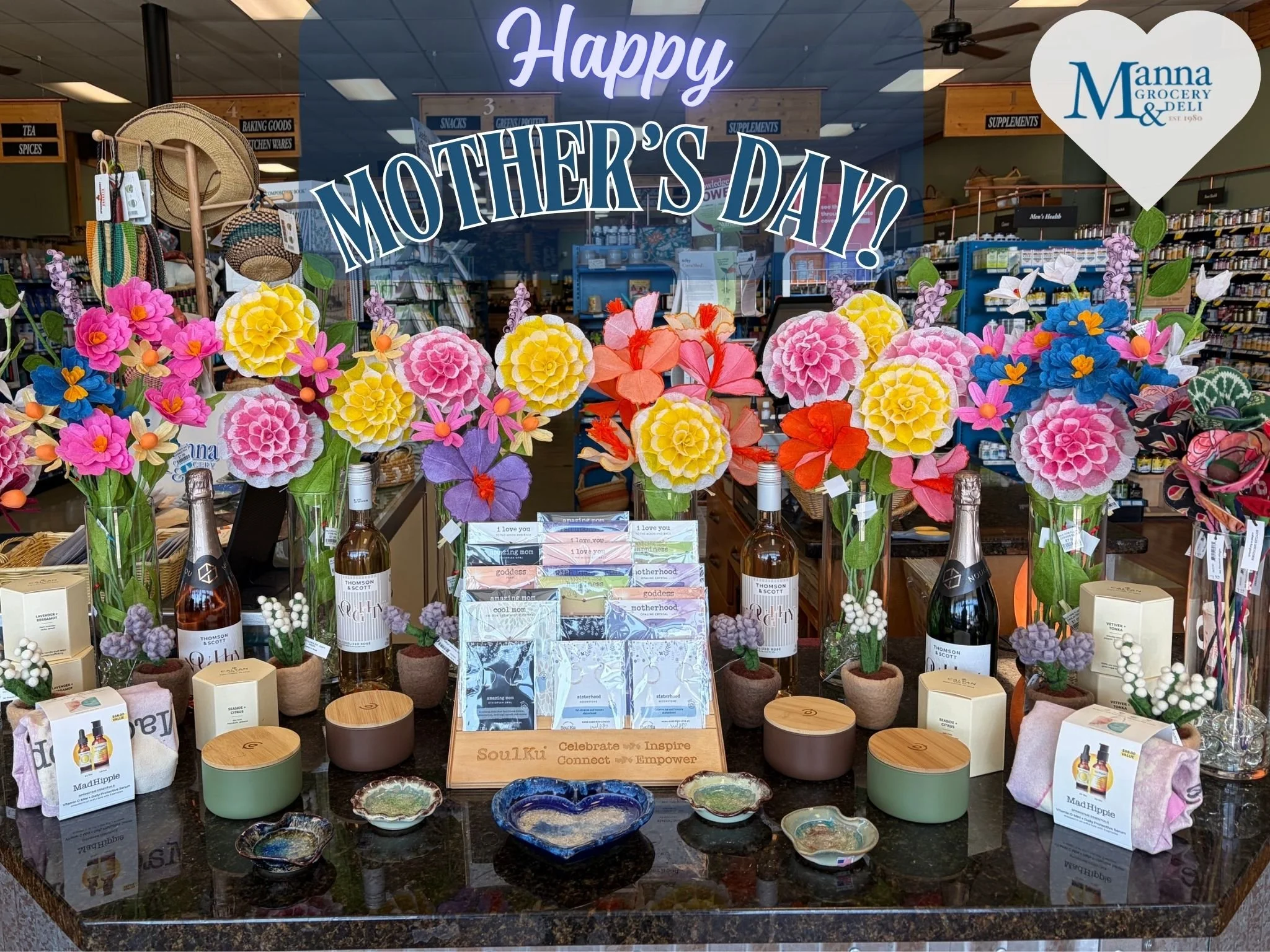 Mother's Day is this Sunday! We have this beautiful Mother's Day display at the front of our store, thanks to our wonderful staff . 

Get her some great gifts like one-of-a-kind handmade jewelry or pottery, candles, cards, and more. Better yet, bring