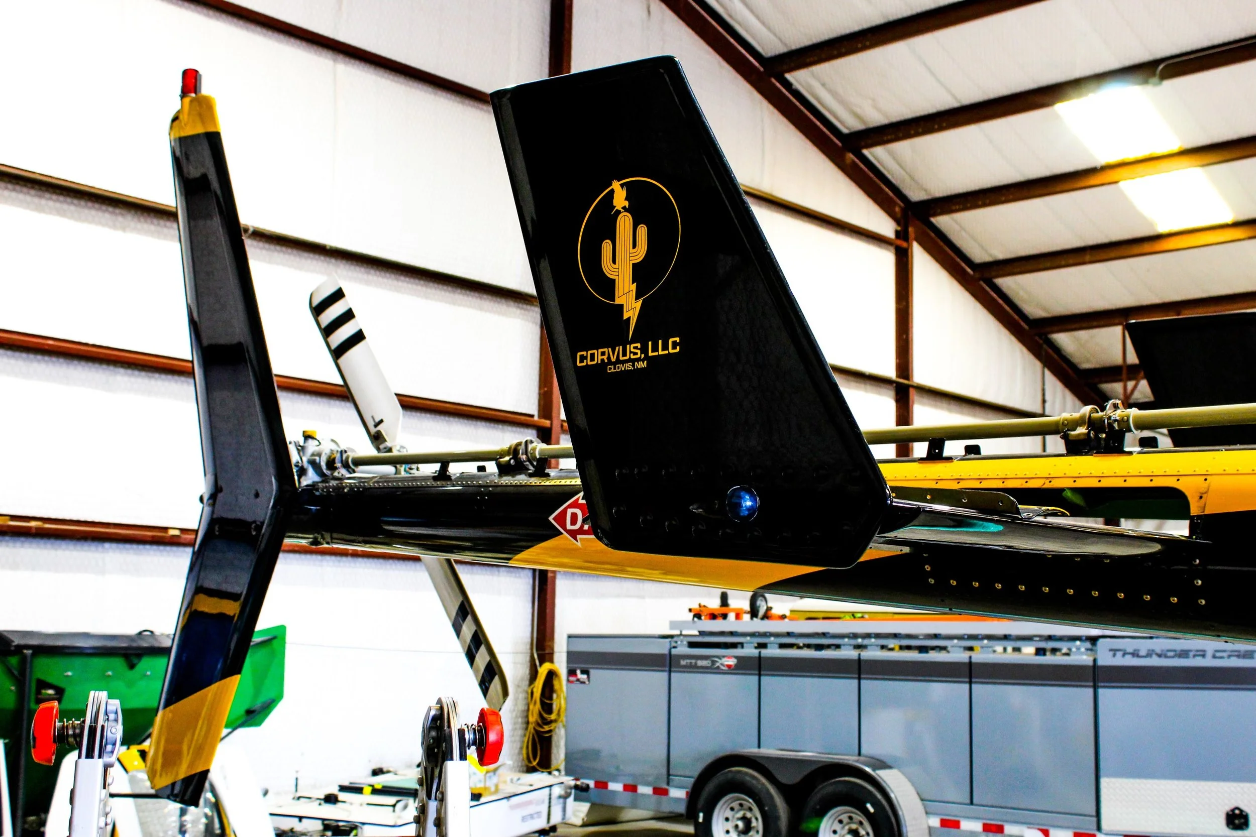 Close-up of a Corvus Helicopter in a hangar, with visible logo and branding.