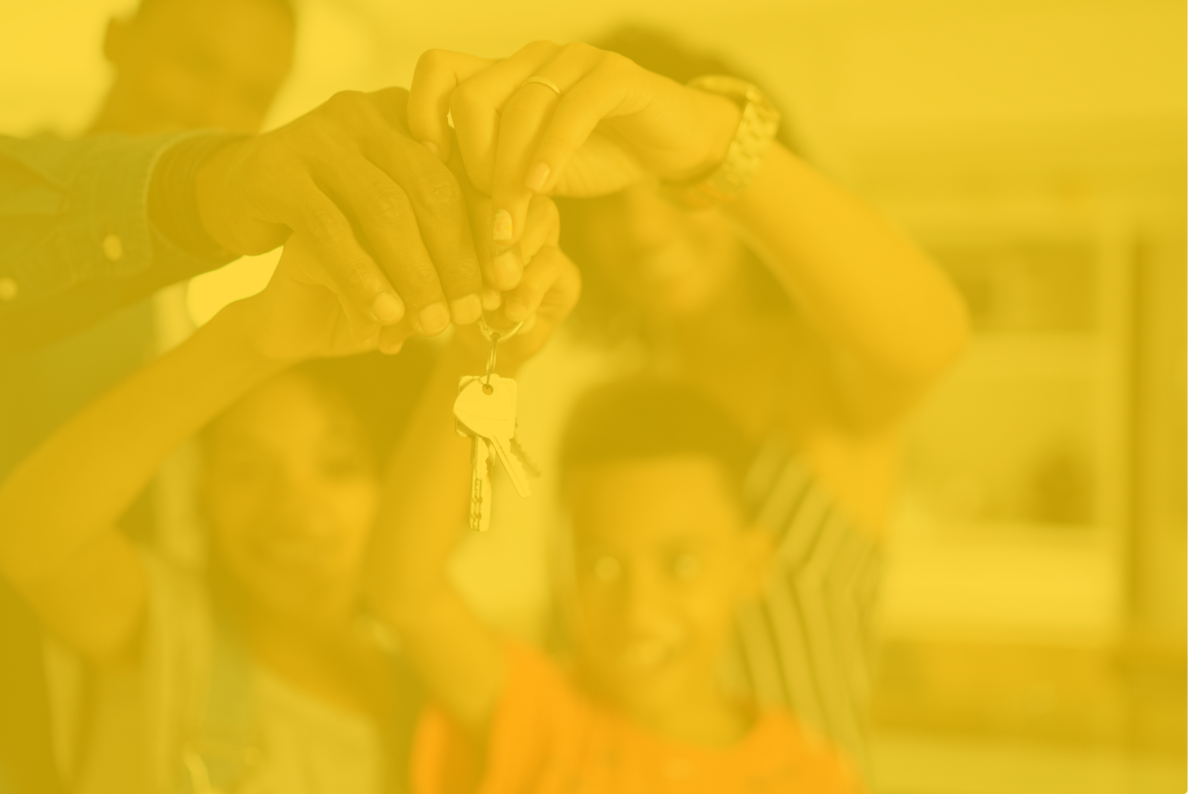 Close-up of hands holding keys with a keychain, with other people in the background at a locker or storage area.