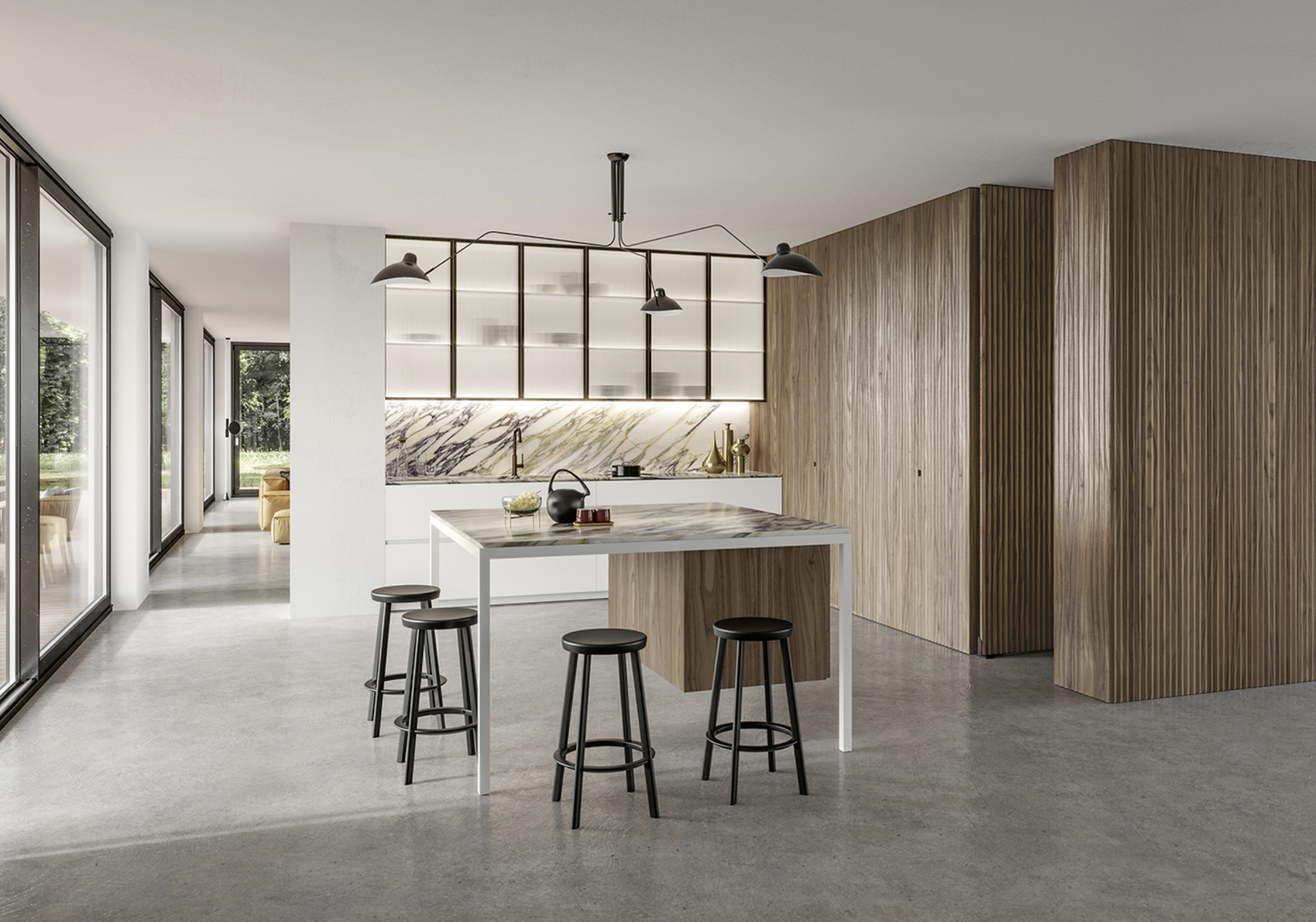 Modern open-concept kitchen with wooden panel walls, marble backsplash, white cabinets, black pendant lighting, and a kitchen island with stools, adjacent to windows and a living space with a yellow sofa in the background.