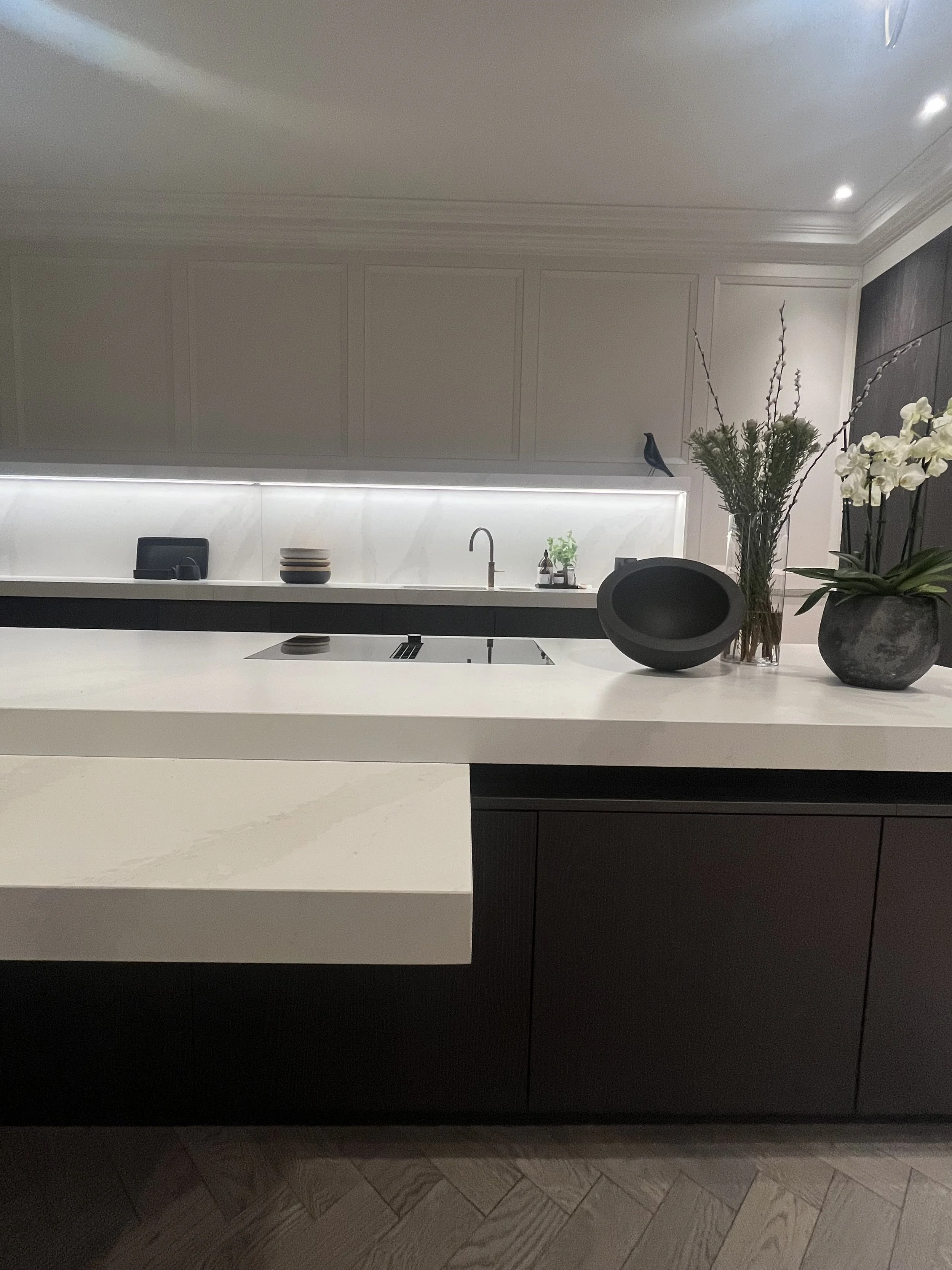 Modern kitchen with Calacatta counter tops and dark stained timber doors designed by Melides Design with a John Pawson bowl