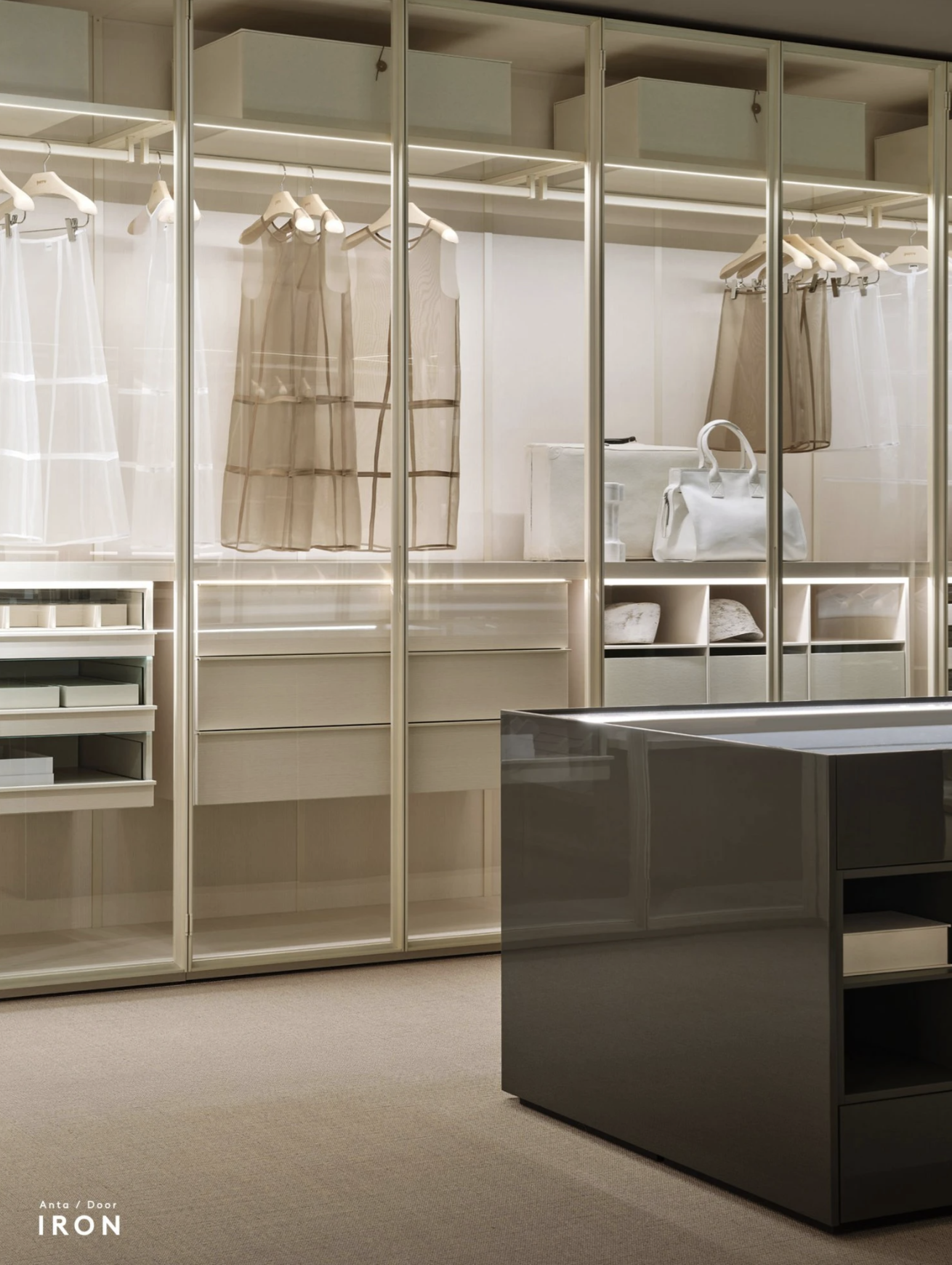 A modern retail display with sheer clothing on hangers, white handbags, and organized shelf storage in a neutral-toned store.