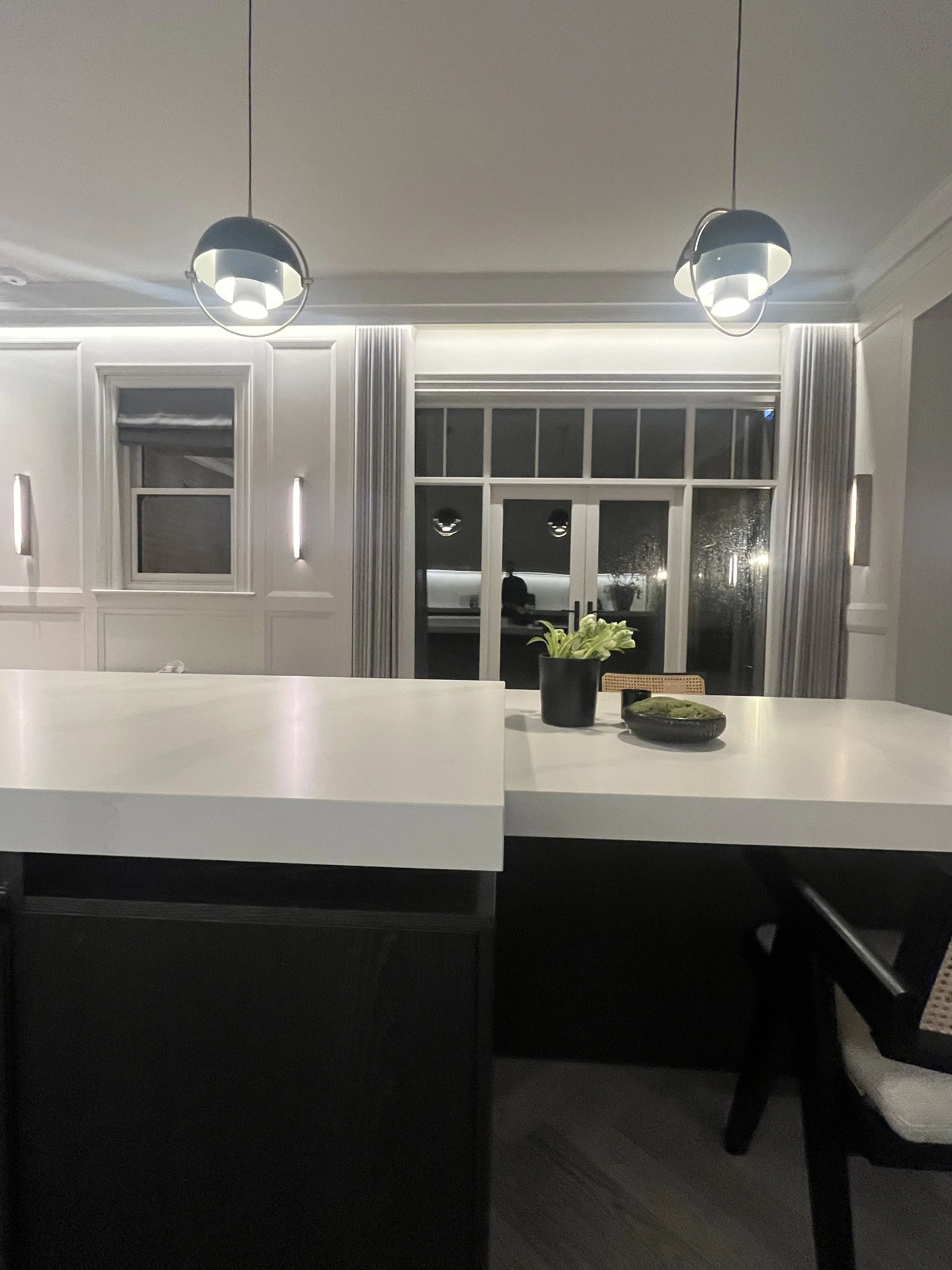 Modern kitchen with Calacatta counter tops and dark stained timber doors designed by Melides Design