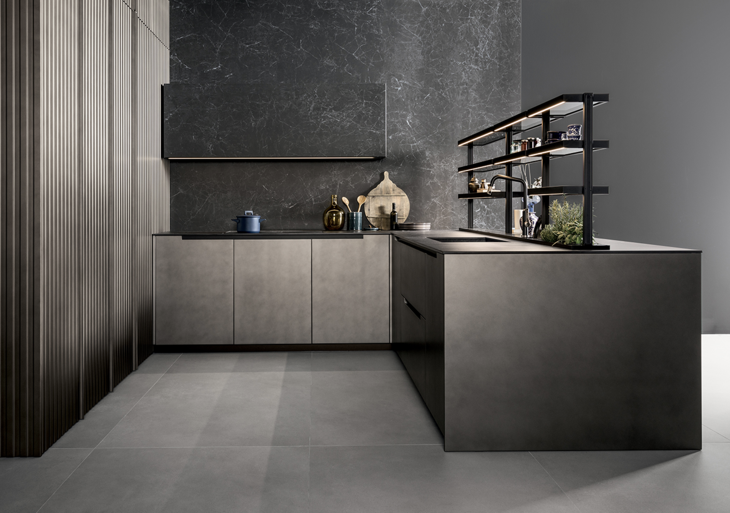 Modern kitchen with dark cabinets, marble backsplash, open shelving, and a minimalist design.