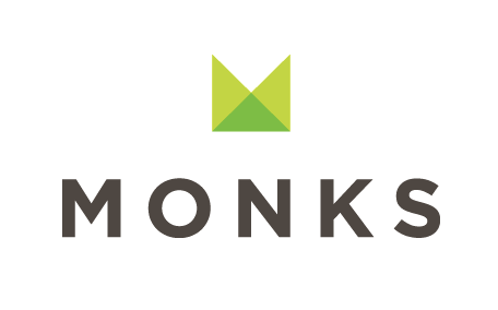 Logo with a green abstract crown symbol above the word 'MONKS' in bold black letters.