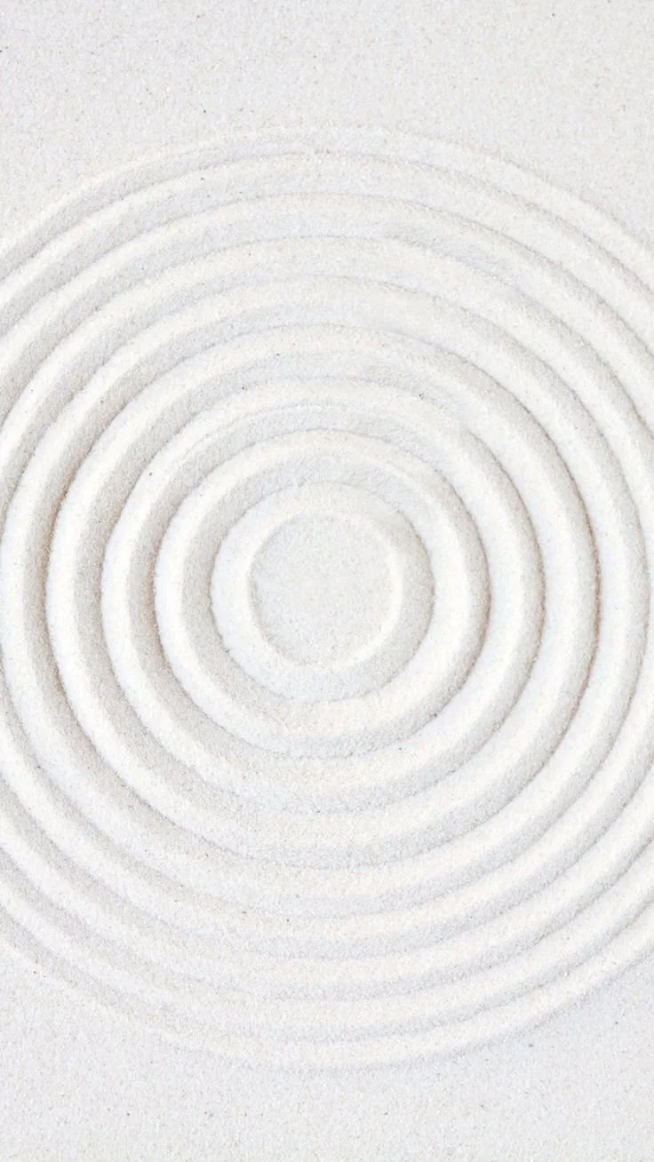 Close-up of a white, textured surface with concentric circular pattern.