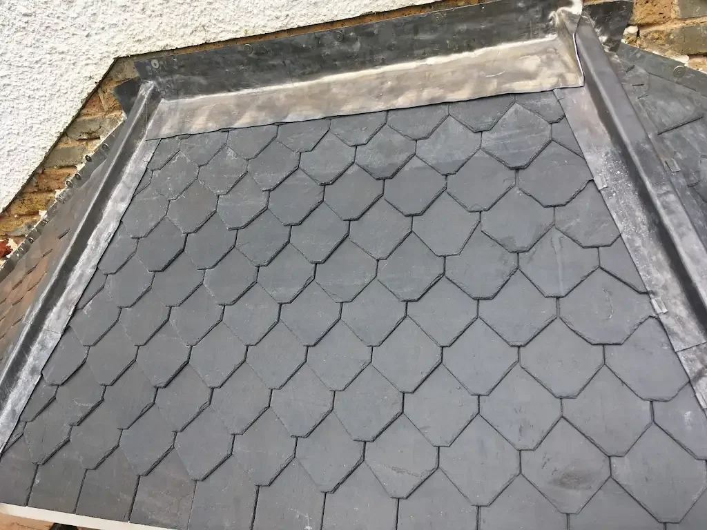 Period-style slate tiling carefully cut and fitted to match the original character and design of the property.