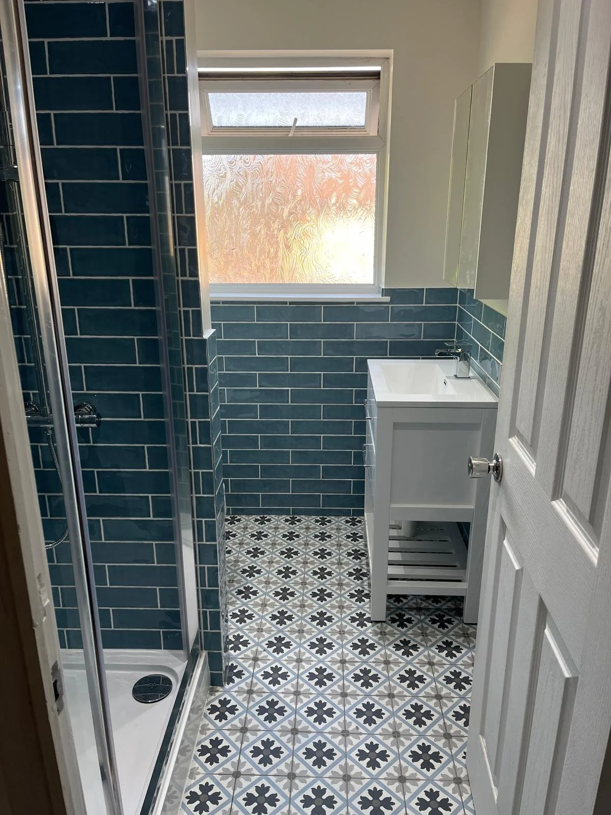 Small bathroom redesign and remodel built to maximise space, including a large walk-in shower cubicle.