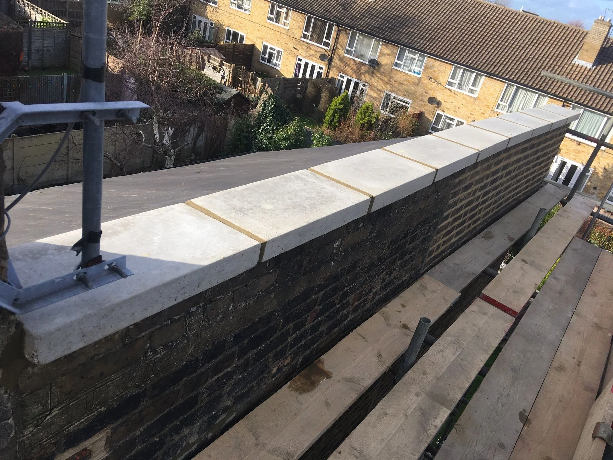 Professional damp proofing and new coping stones added to resolve damp issues in a period property.