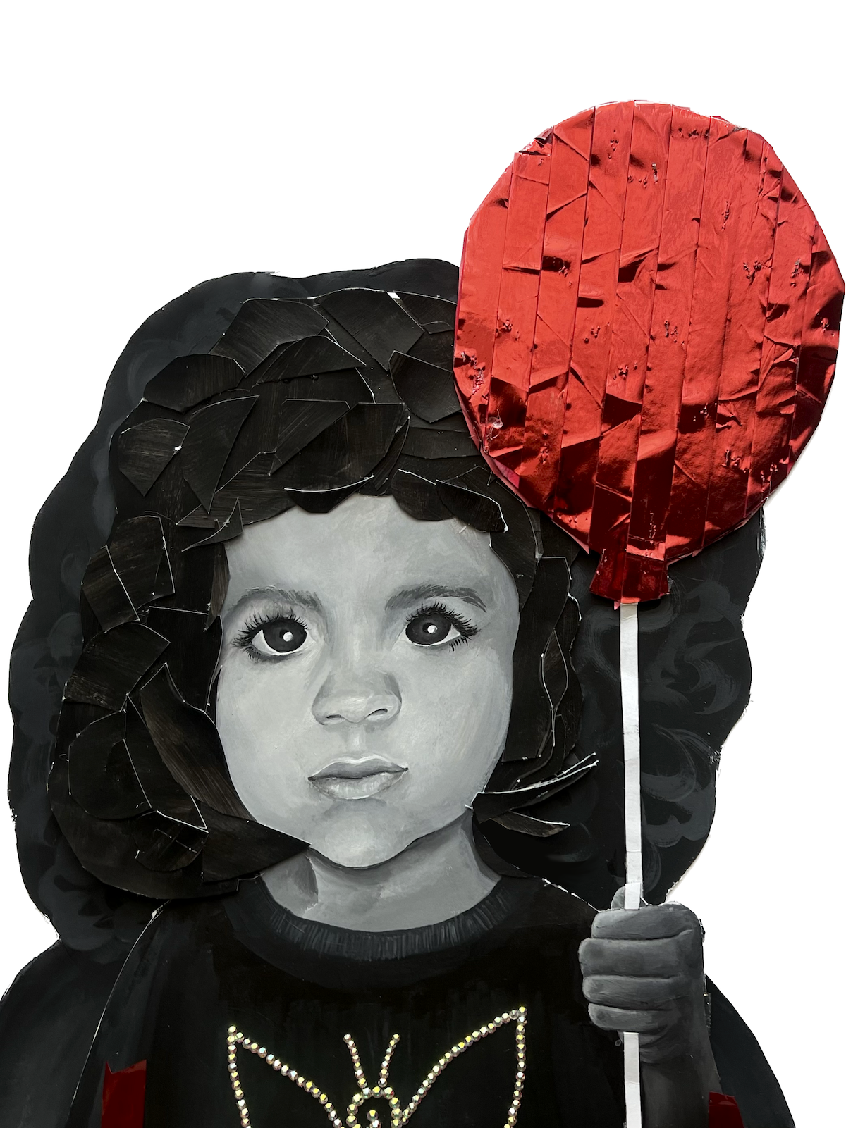 A black-and-white portrait of a young girl with curly hair and large eyes, holding a red, paper-made balloon on a stick.