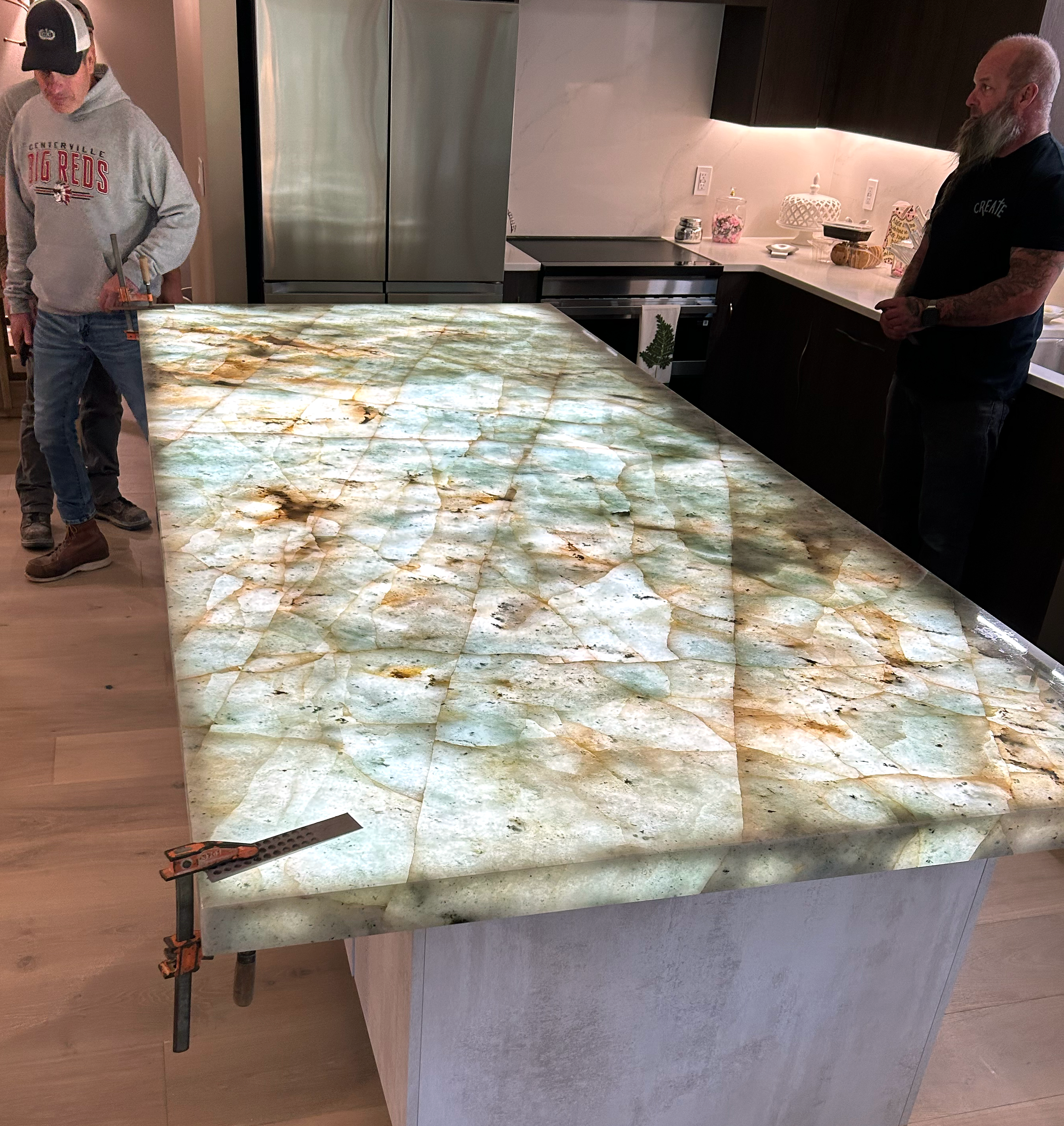 Stonecrafters custom backlit onyx stone kitchen island countertop – luxury natural stone fabrication