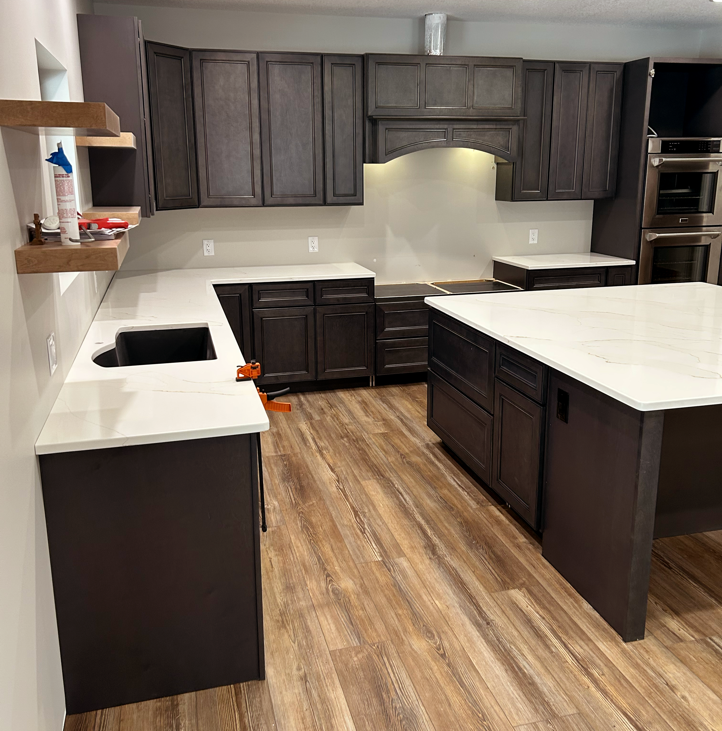 Custom marble pattern kitchen countertops and island by Stonecrafters – professional stone fabrication and installation