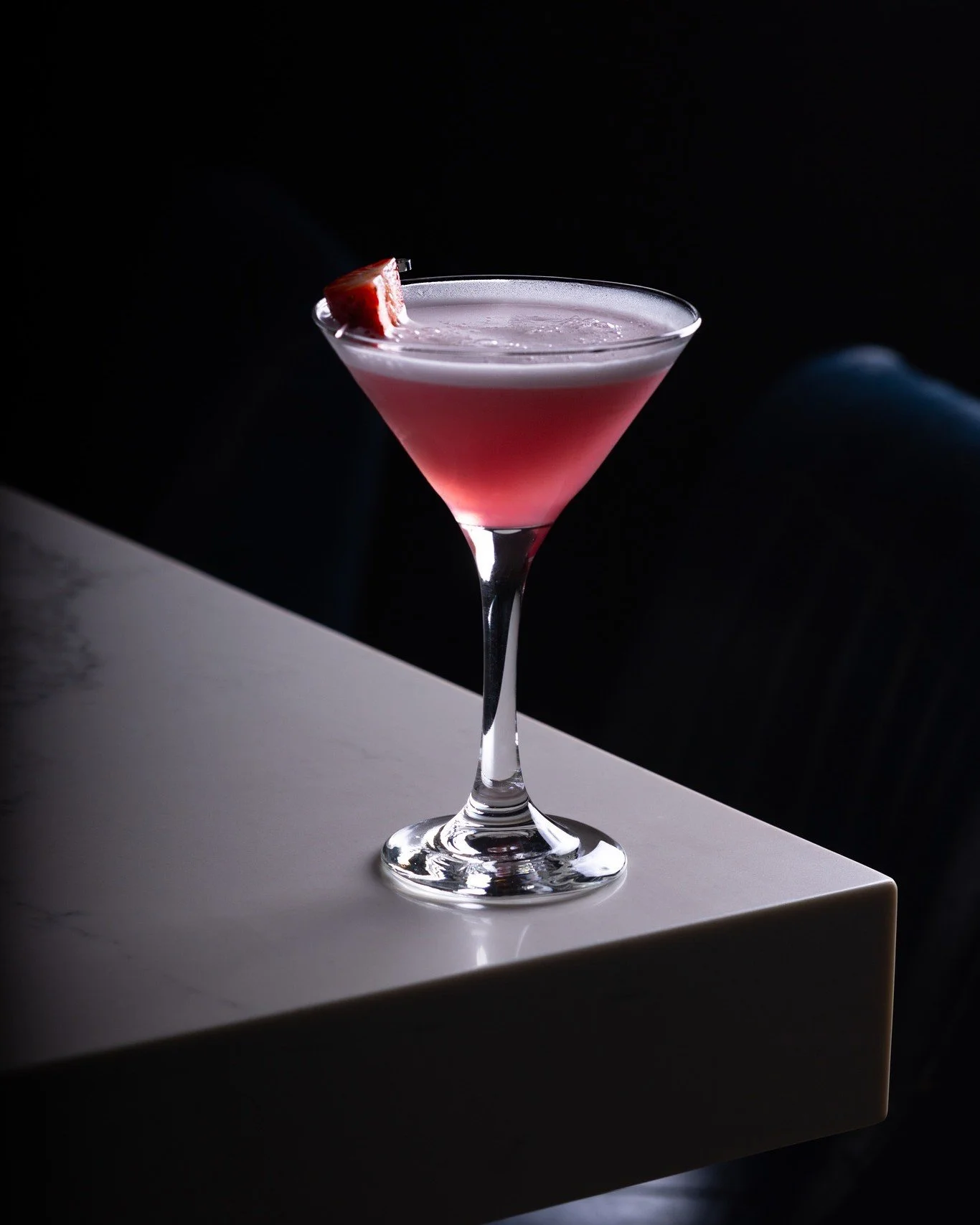 Thyme is not an obvious choice for a martini. But that's exactly why it works. The herbal note cuts through the strawberry, keeping it from being just another pink drink.

The foamy top isn't just for looks either. It softens the first sip and makes 