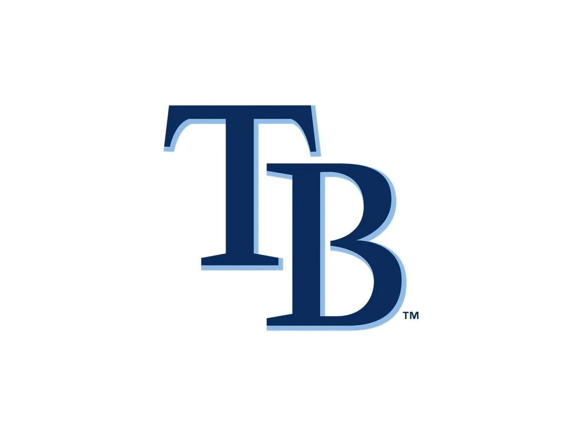 Logo with large dark blue uppercase letter T overlapping a large dark blue uppercase letter B on a white background.