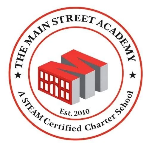Logo for The Main Street Academy, a STEAM certified charter school established in 2010, featuring a red 3D building icon surrounded by black and red circular text.