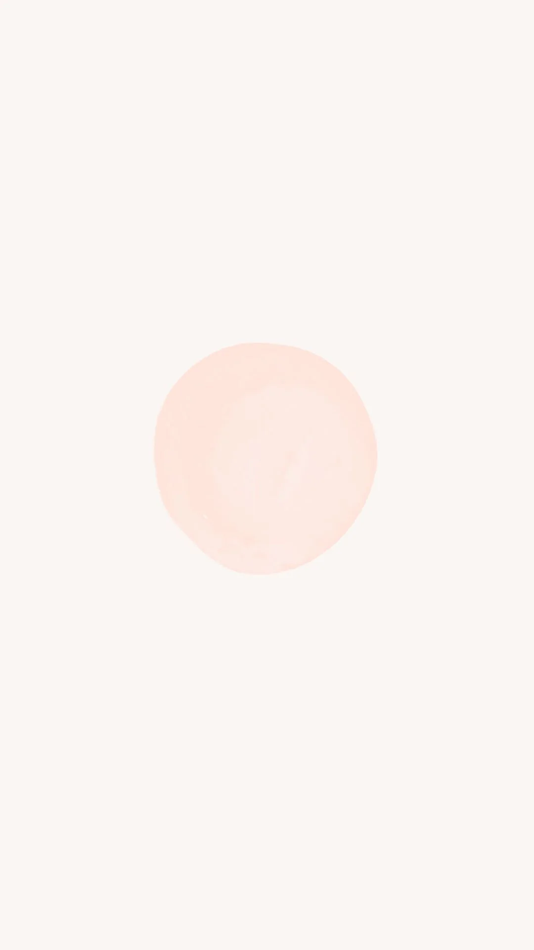 A round, pale pink button or object centered on a light background.