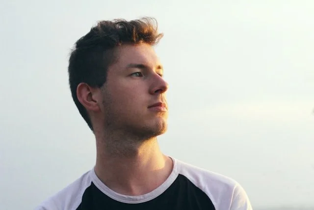 A man in a shirt looking away