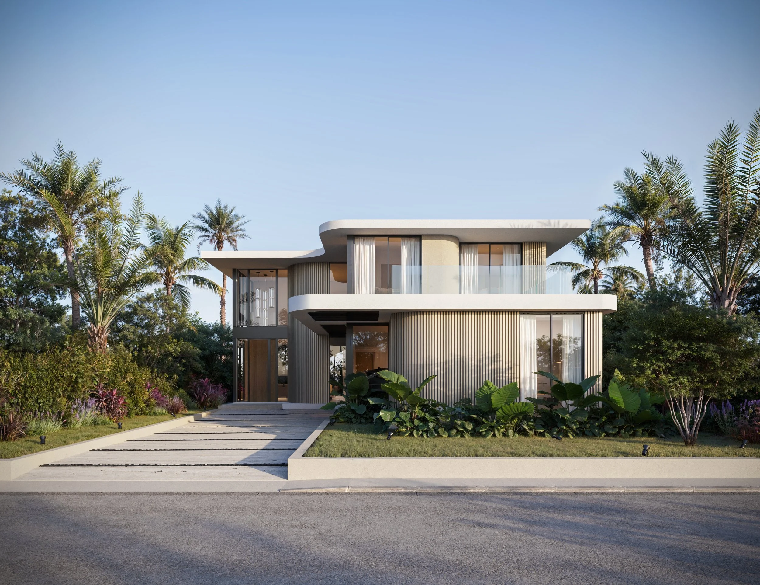 Modern two-story house with curved design, large windows, and balcony, surrounded by tropical trees and plants.
