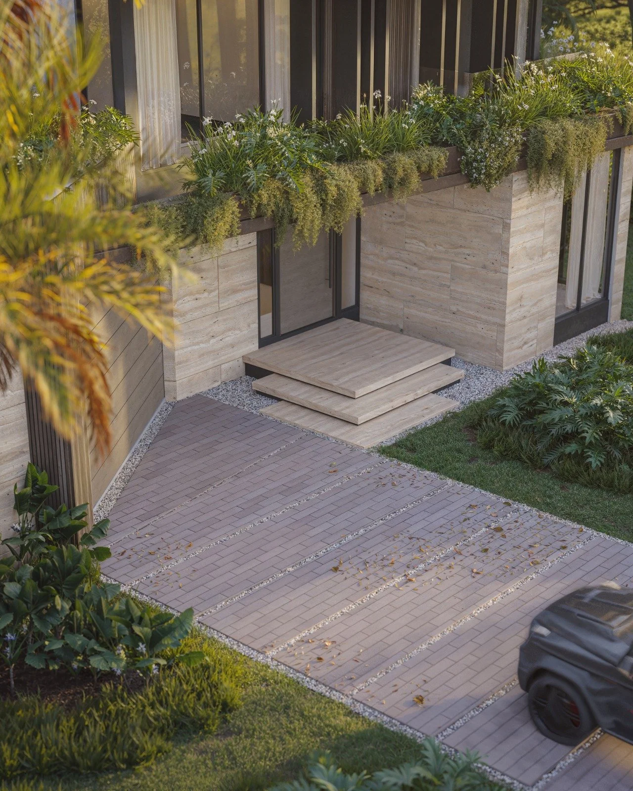 Modern house entrance with stone steps, large sliding glass door, surrounding greenery, and a paved driveway with a car partially visible.