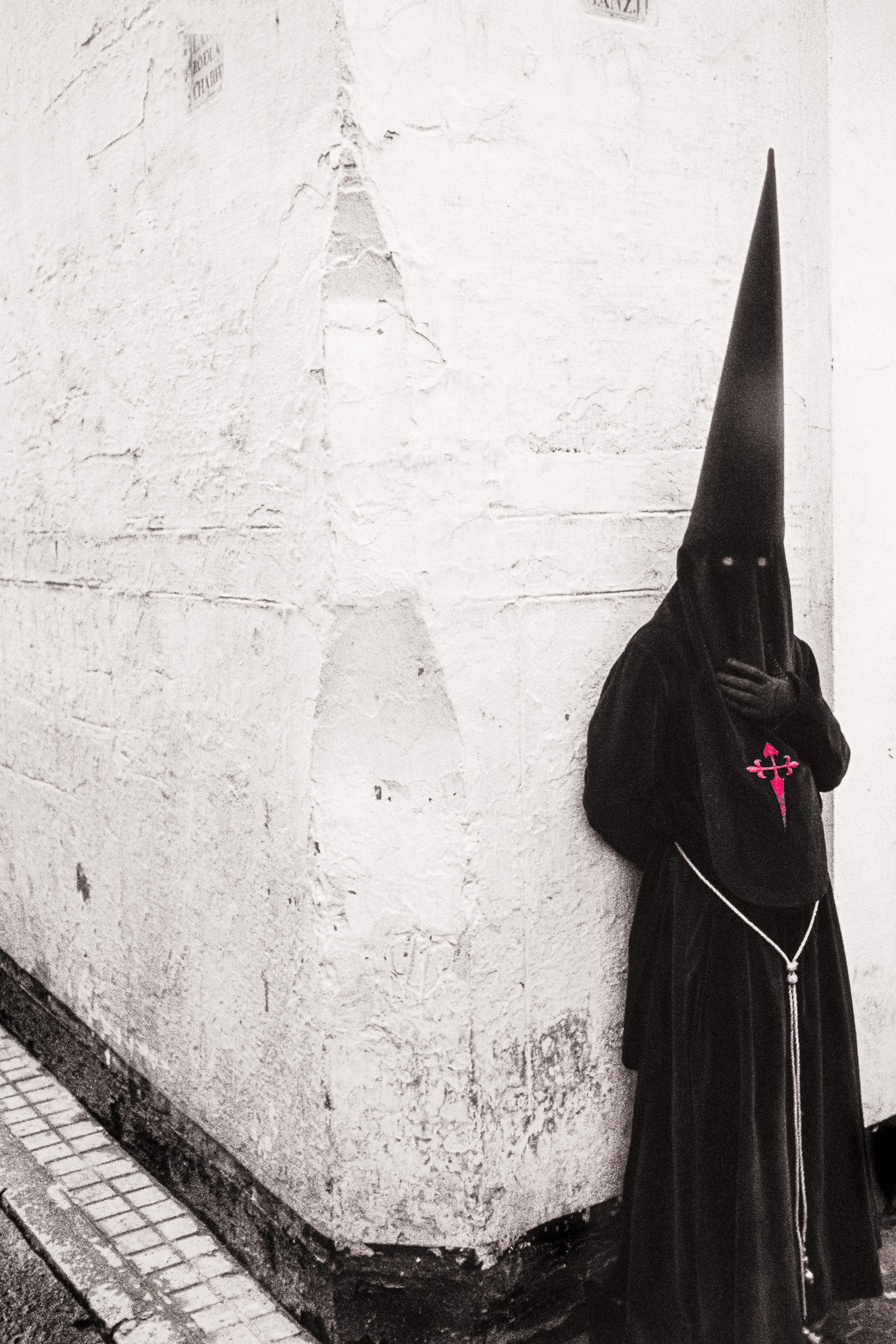 In Jerez de la Frontera we encountered a rain-soaked Semana Santa. Persistent rain shaped the streets and created a subdued setting in which these rare photographs were taken.
The images include three Guardia Civil officers sheltering in a doorway wi