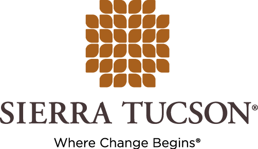 Sierra Tucson logo with a stylized brown and purple tree design.