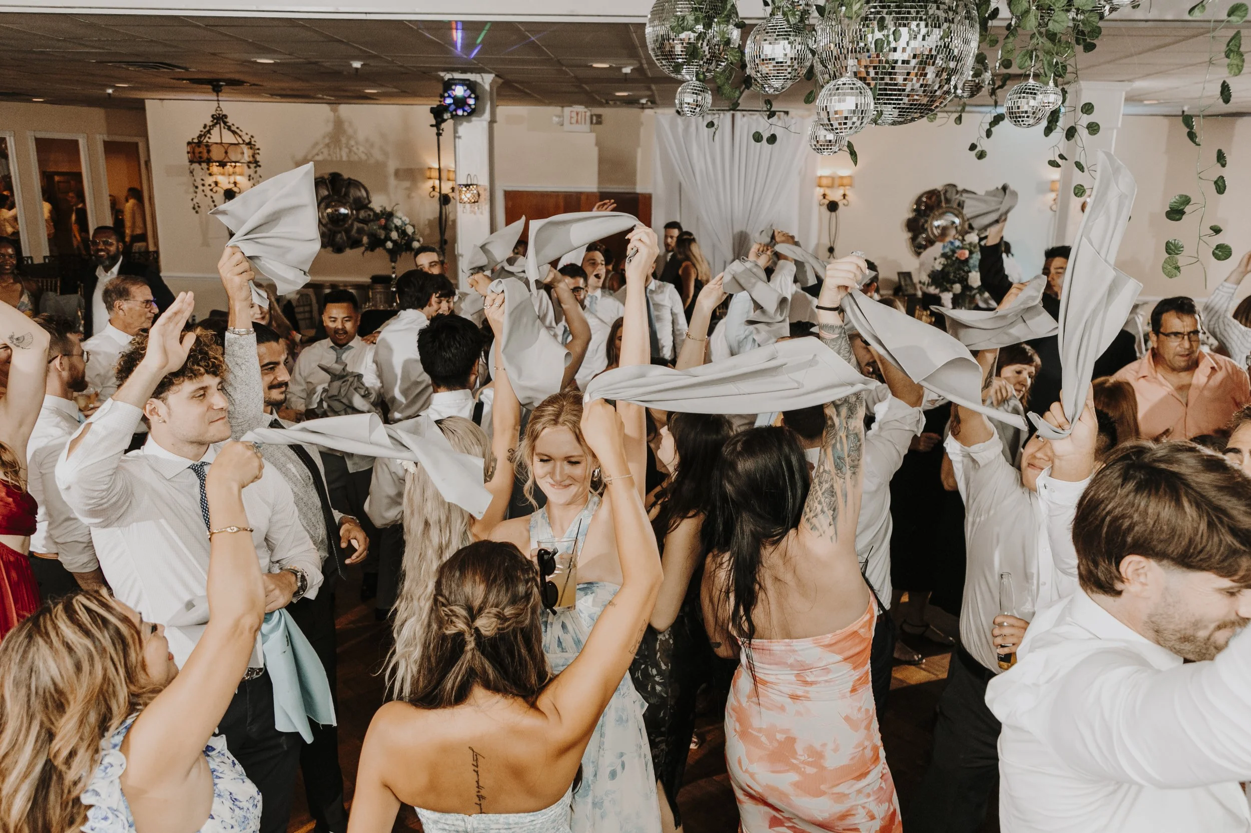 Guests waving napkins in the air
