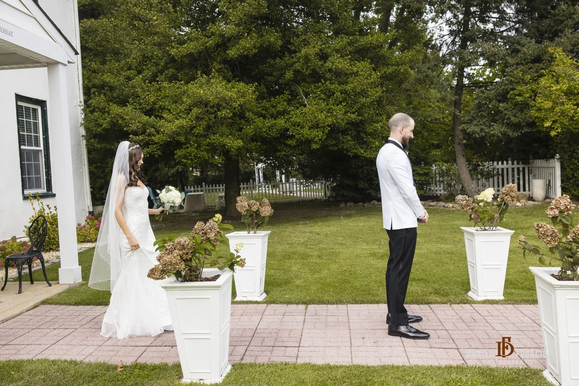 bride and groom outside manor 