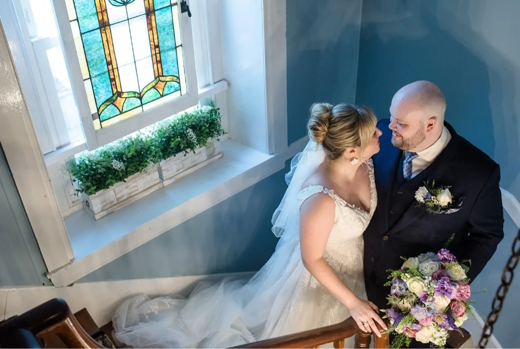 Brid mand groom on spiral stair case
