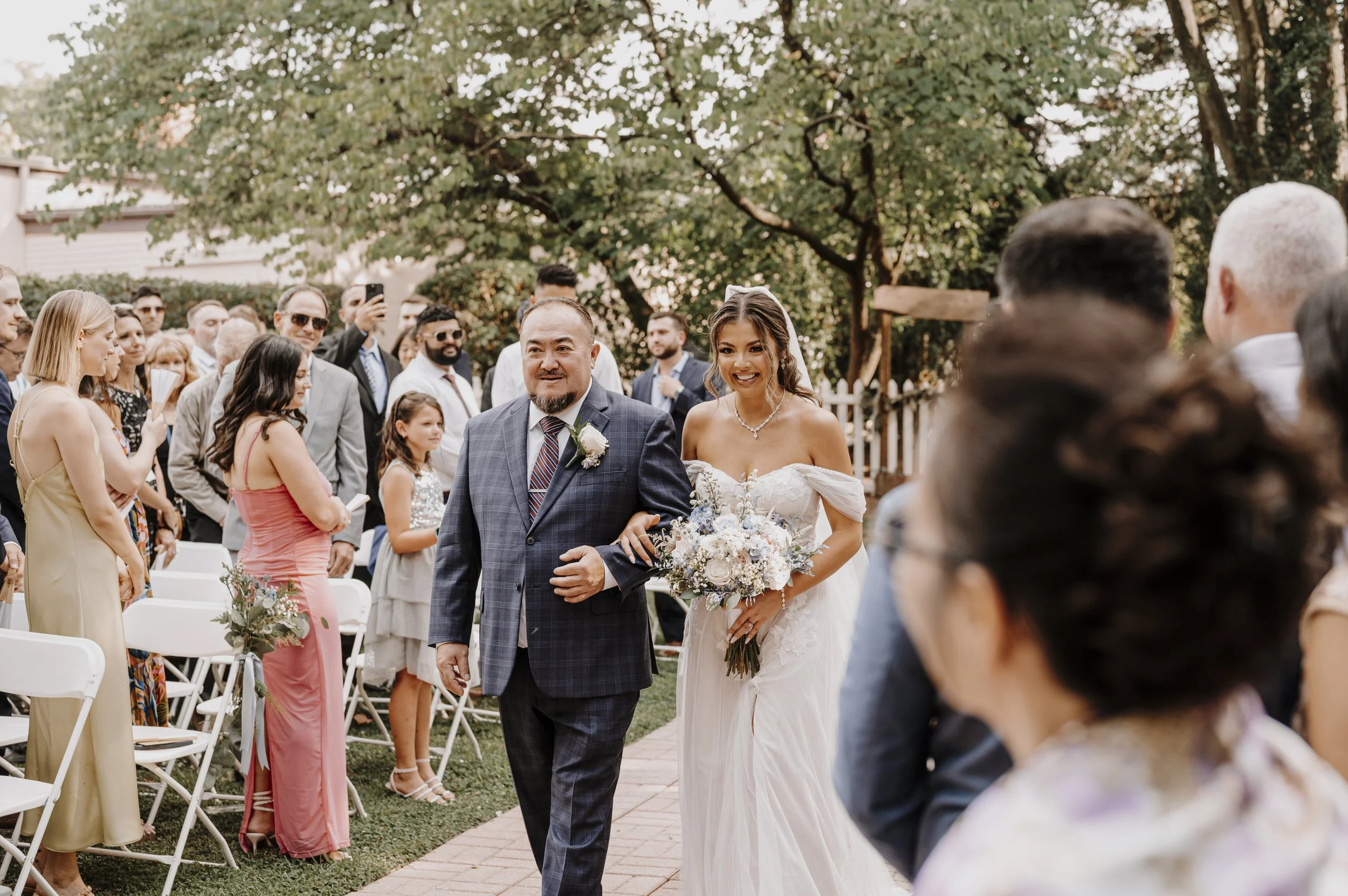 Bride and father walking down asile