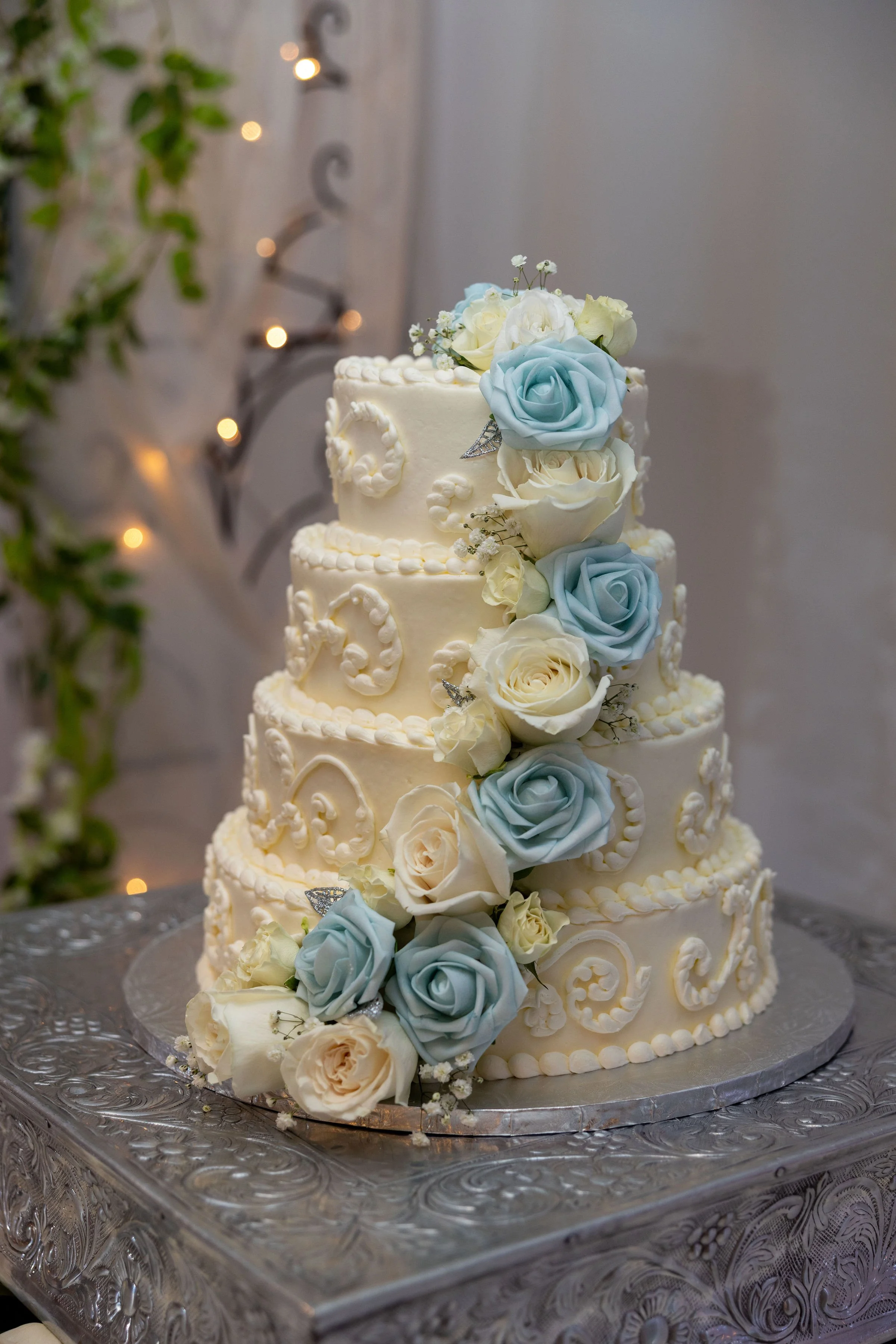 White and blue flowers on wedding cake