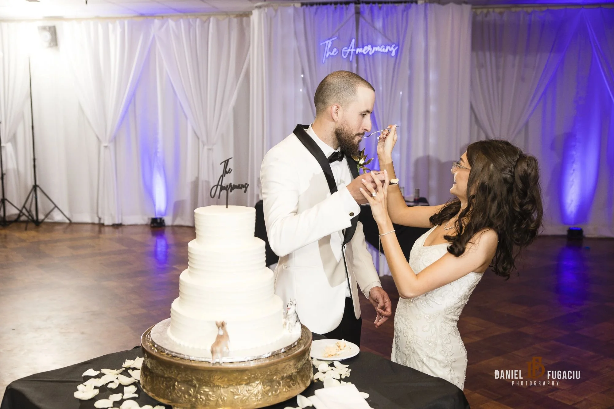 Bride and groom feed cake to each other