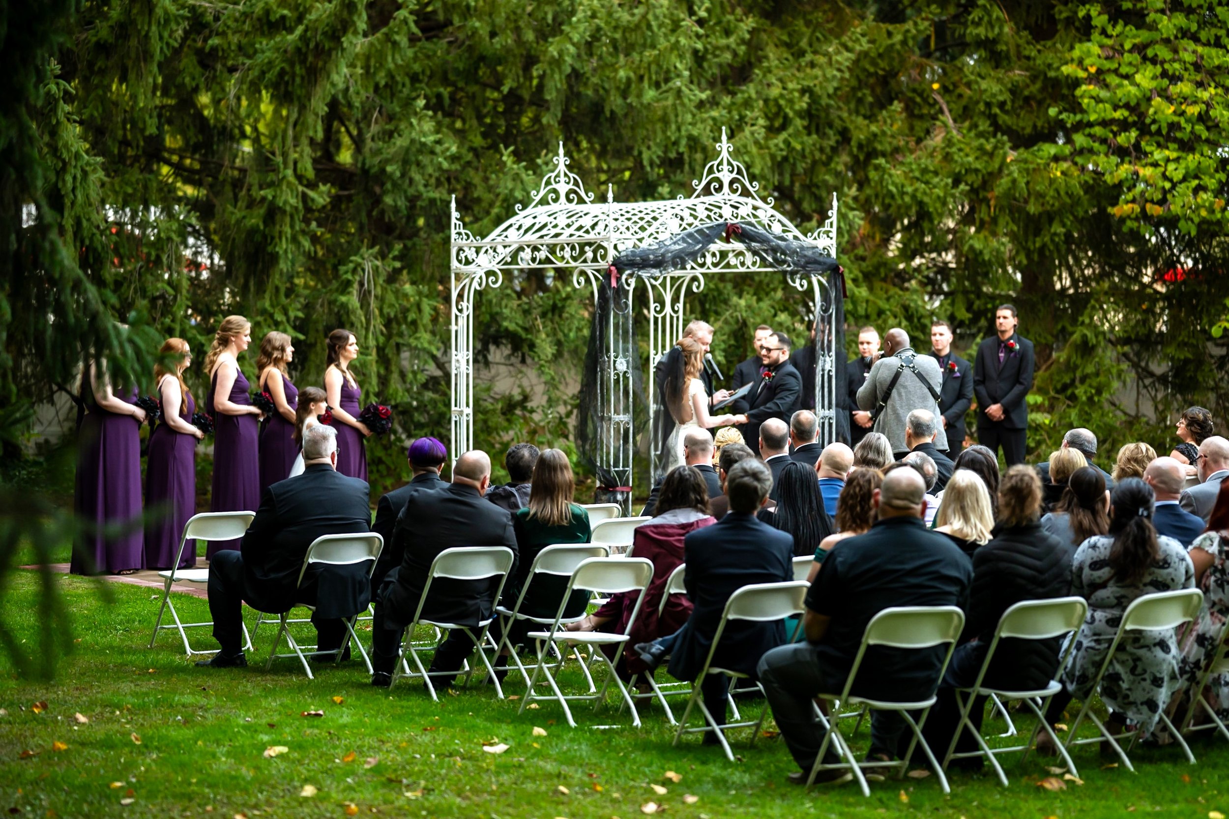 Wedding ceremony under garden arch