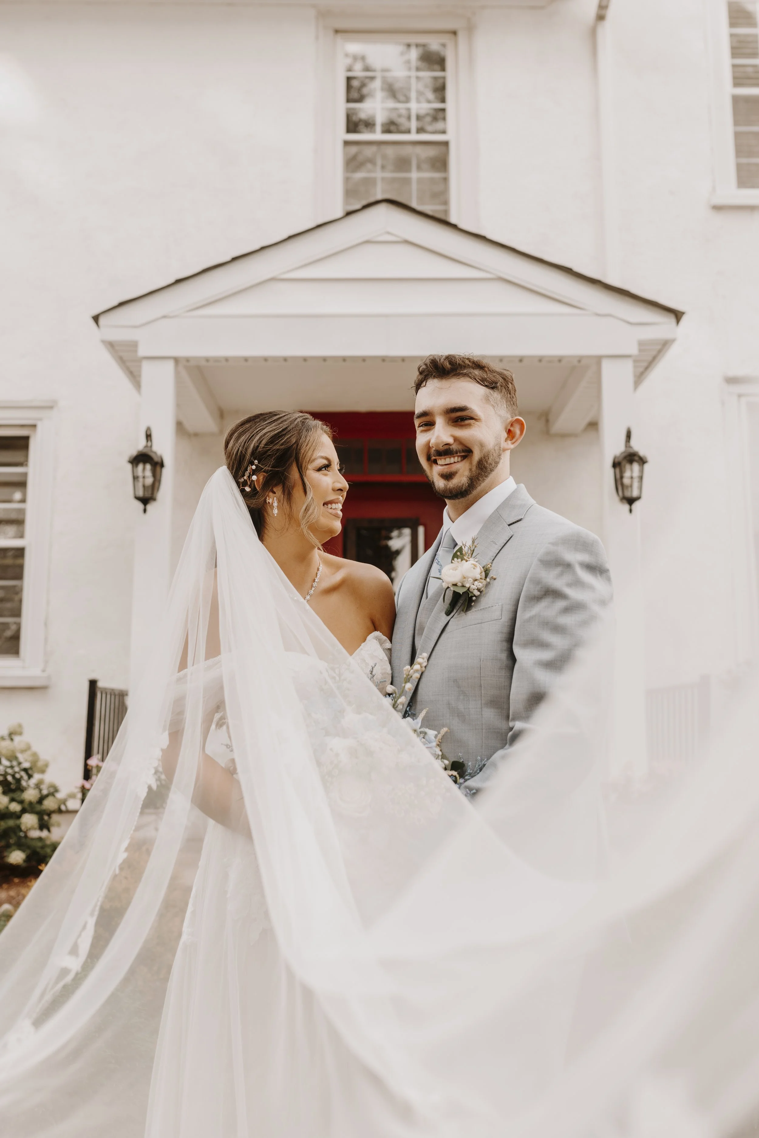 Bride and groom with flowing veil
